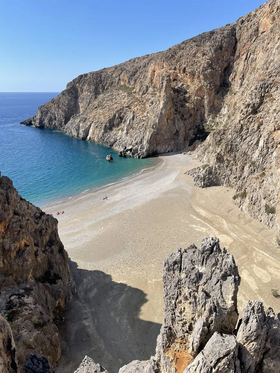 The pebble cove at the mouth of the Agiofarango gorge, closed in by vertical rock