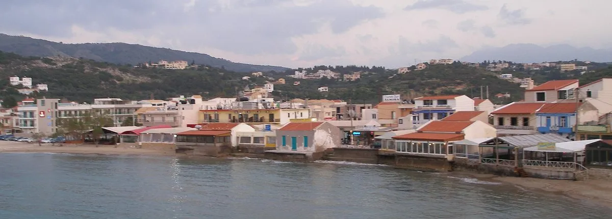 The taverna-lined waterfront curve of Almyrida