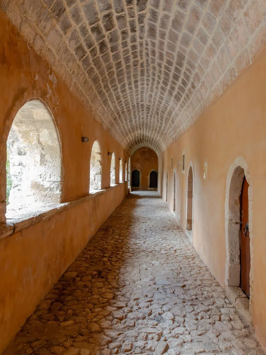 The vaulted corridor beside the monastery cells