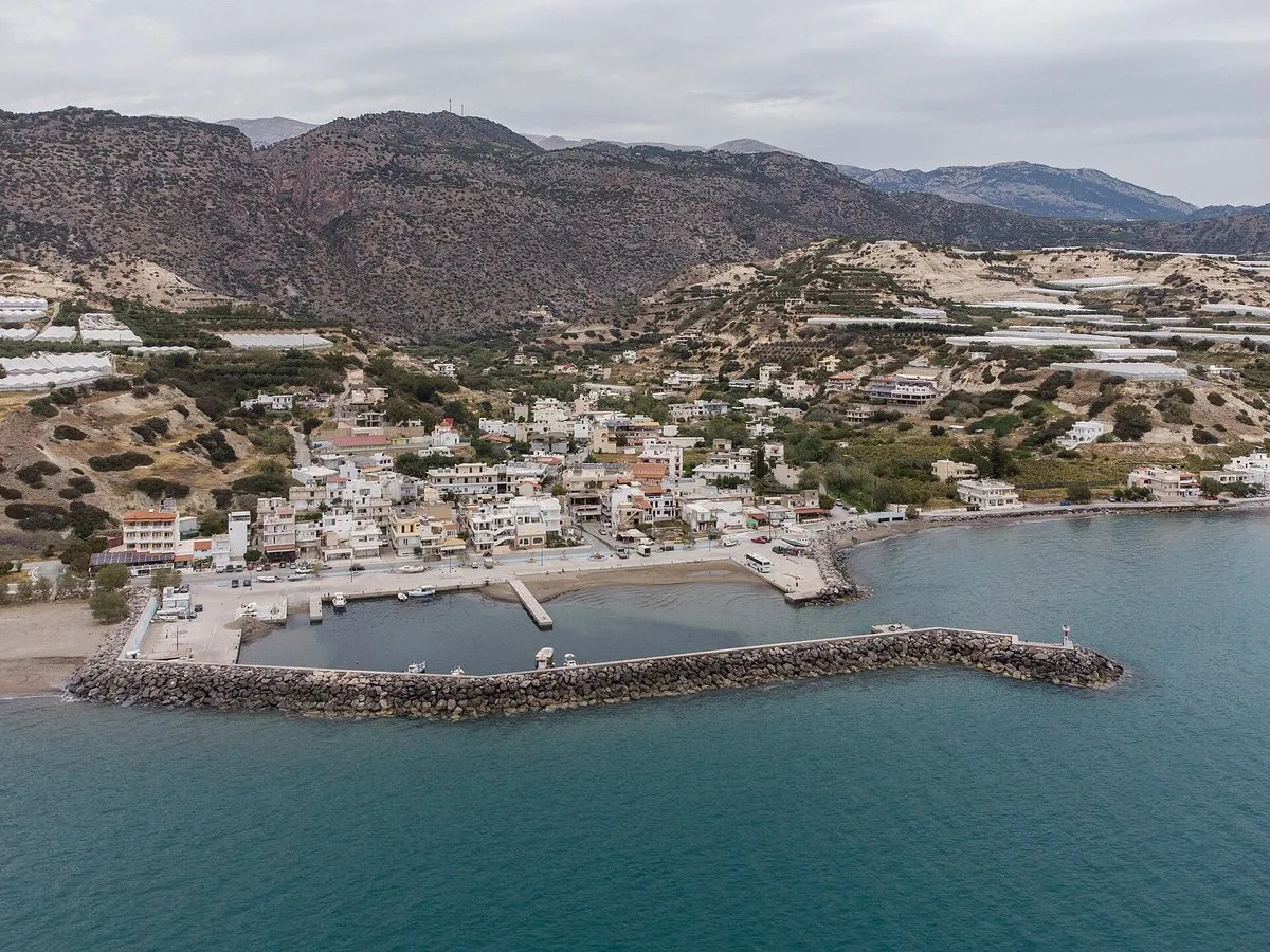 Arvi with its mole, greenhouses and the gorge mouth behind