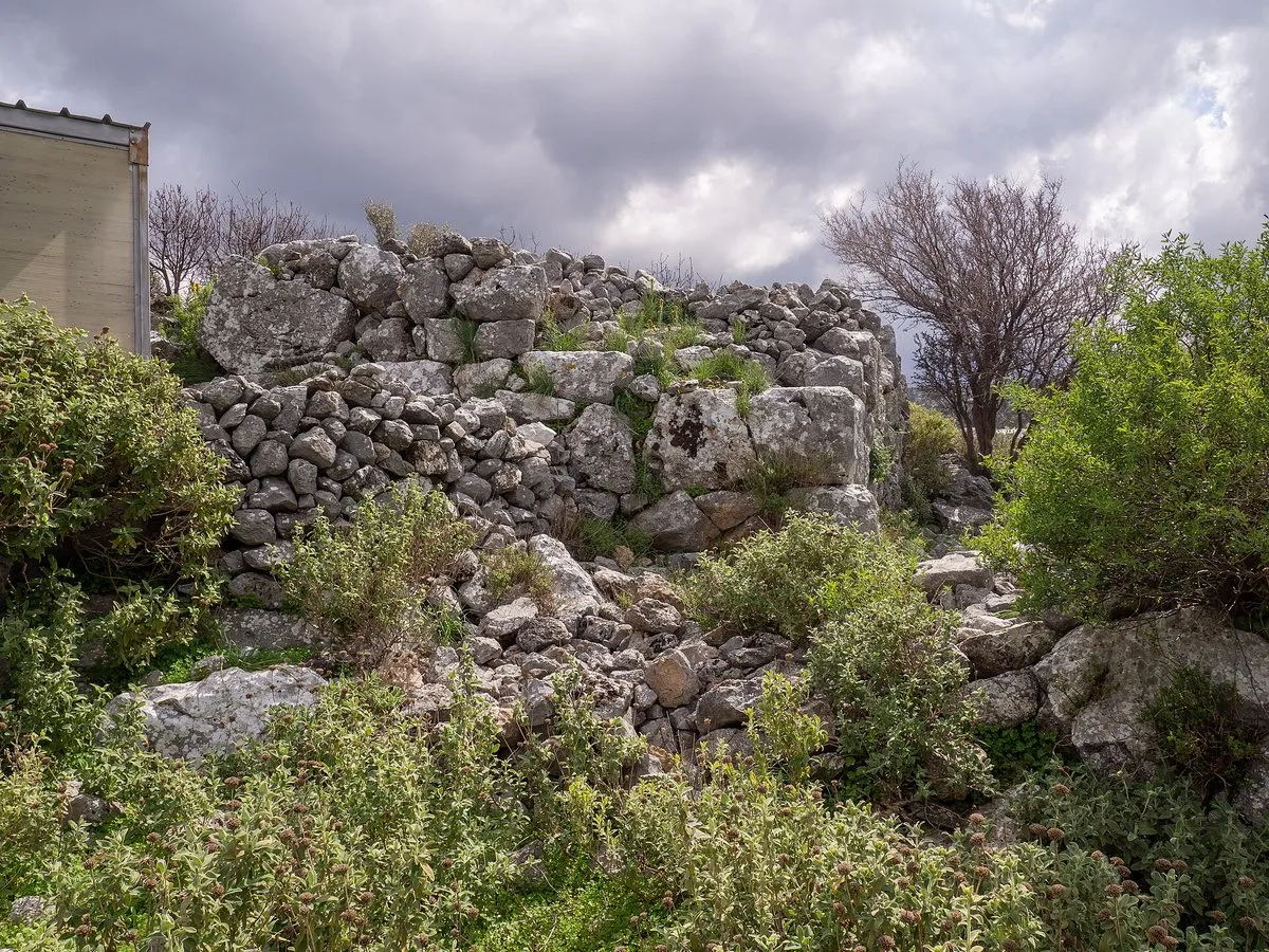 Ancient walls of Axos among the greenery