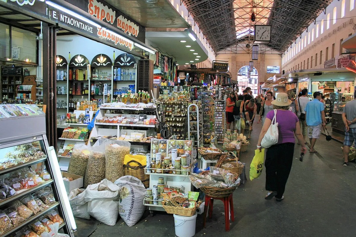The covered aisle of the municipal market in Chania, stalls on both sides