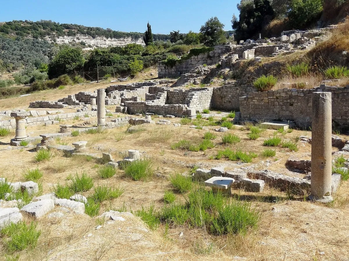 Excavated ruins and a standing column at the Eleftherna archaeological site