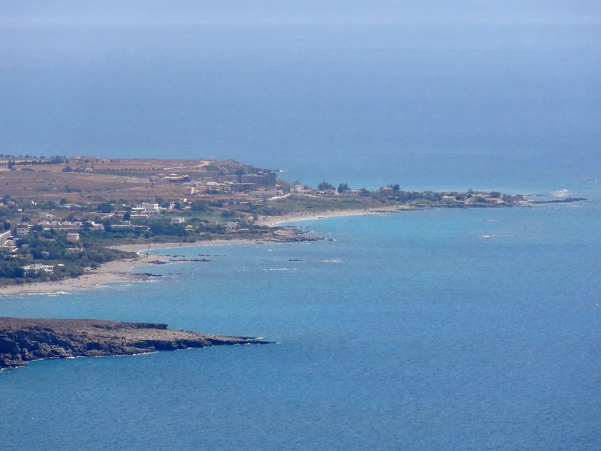 The coast at Frangokastello, shallow turquoise water below the mountains
