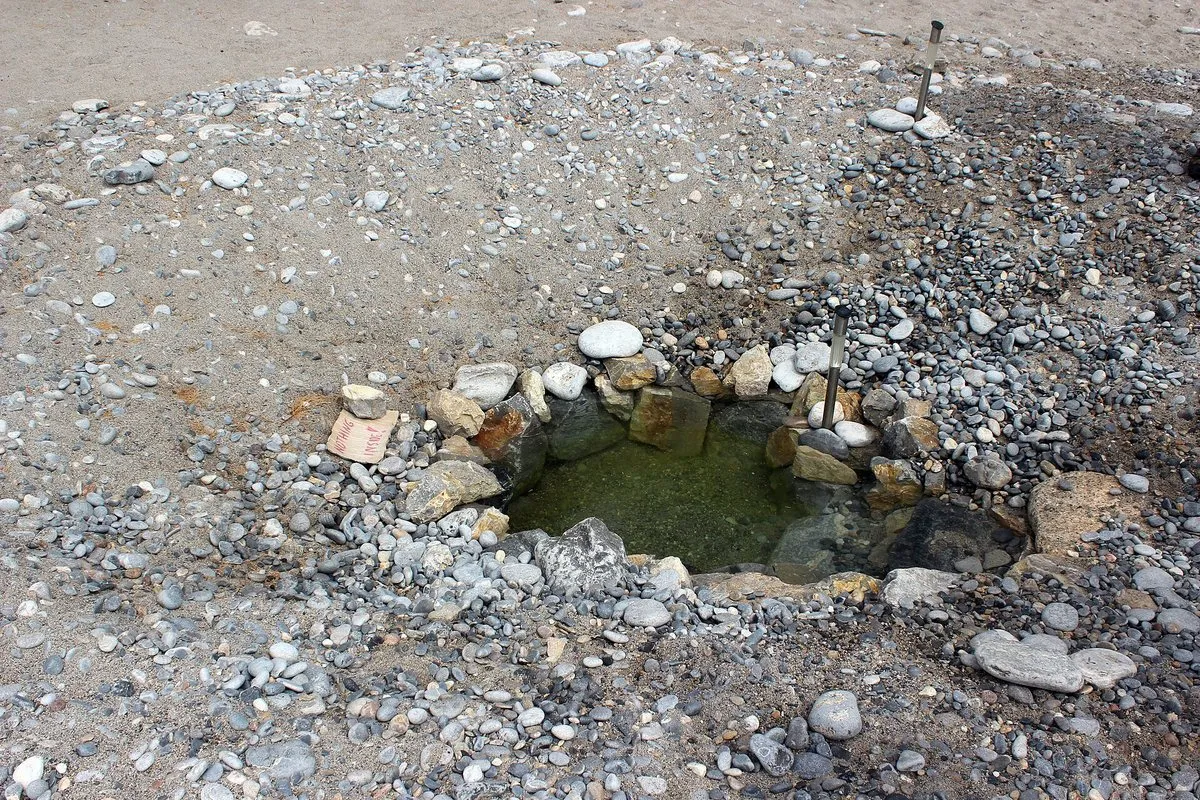 The pebbles and the fresh water seeping beneath them