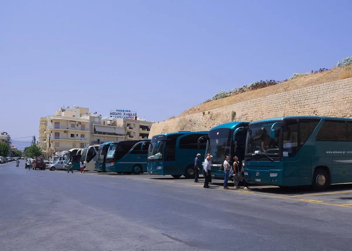 Bus Station B in Heraklion, buses parked beneath the Venetian city walls at the Chanioporta