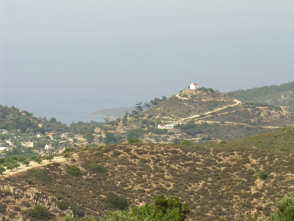 The cave chapel on top of Kastellos rock with the Libyan Sea beyond