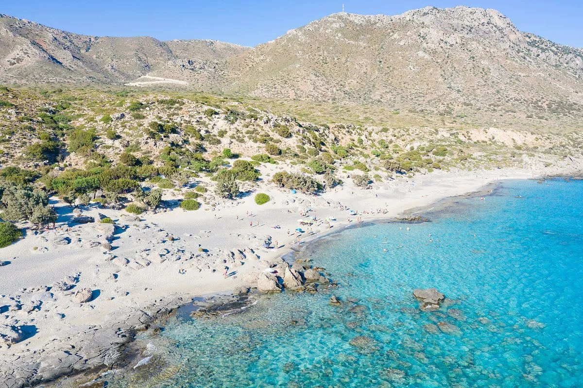 Junipers, white sand and turquoise water at Kedrodasos