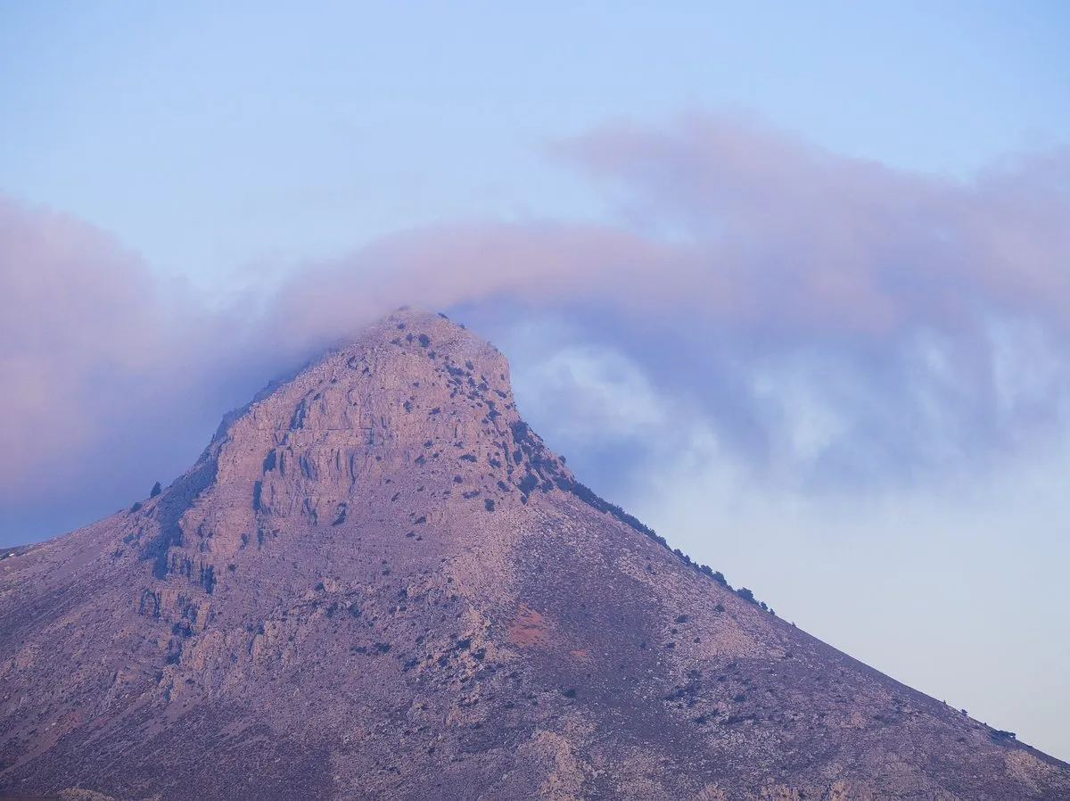 The bare peak of Kofinas in cloud