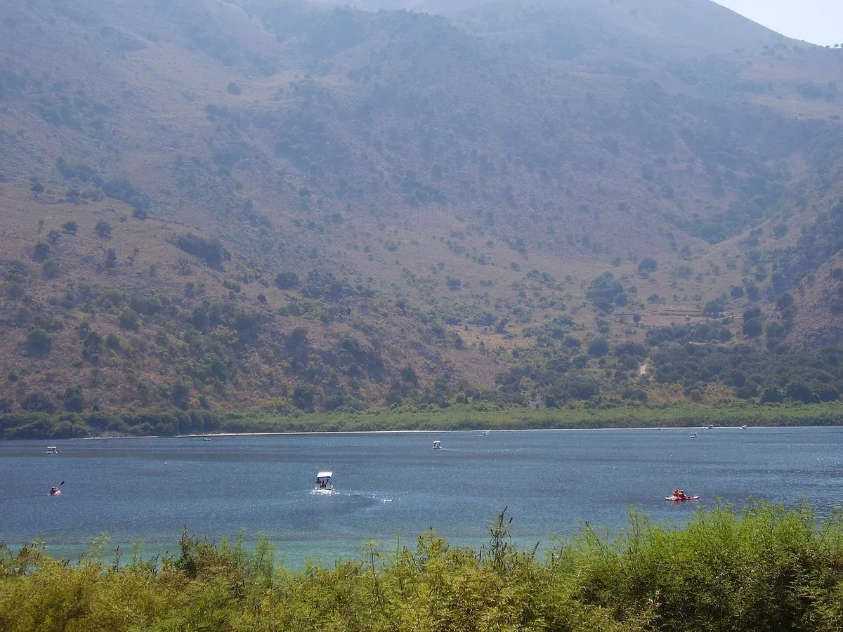 Pedal boats out on the green water of Lake Kournas