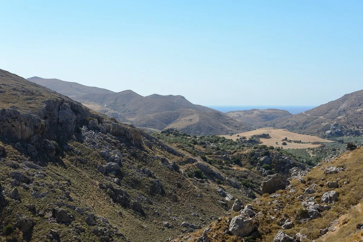 The Kourtaliotiko gorge cutting down towards the Libyan Sea between bare limestone ridges