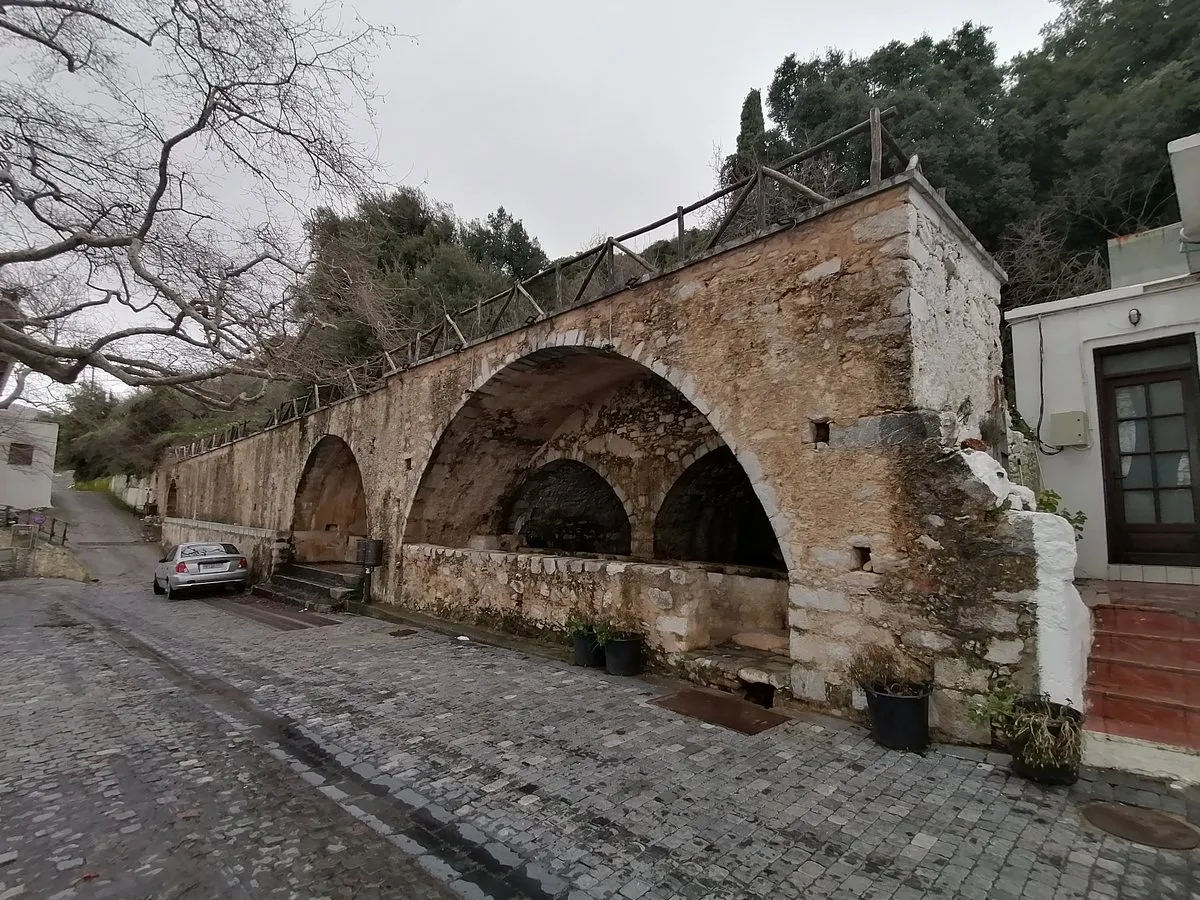 The Venetian fountain arches on the village street at Krasi