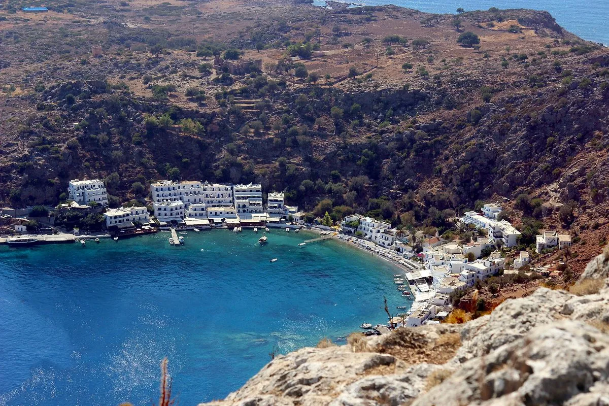Loutro seen from above, white village around a sheltered blue bay