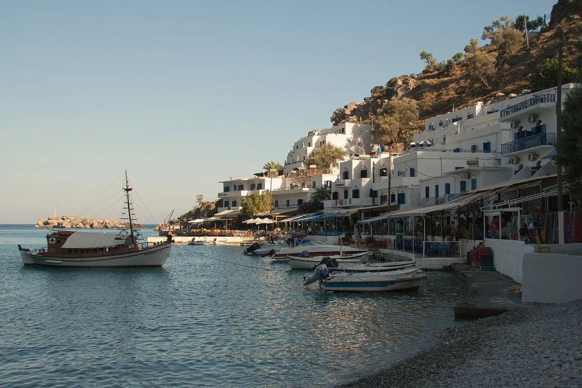 The Loutro waterfront at dusk with fishing boats moored