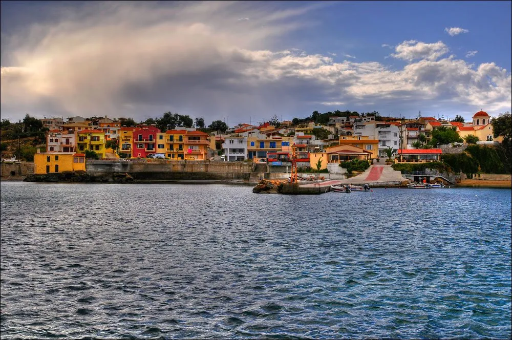 The small harbour at Panormo with the stone village behind it