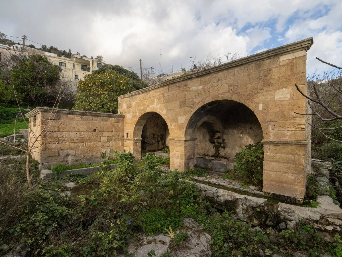 The stone arches of the Kato Vrysi fountain house at Pefki