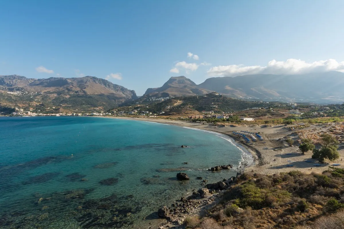 The wide sandy bay at Plakias with the mountains dropping straight into it