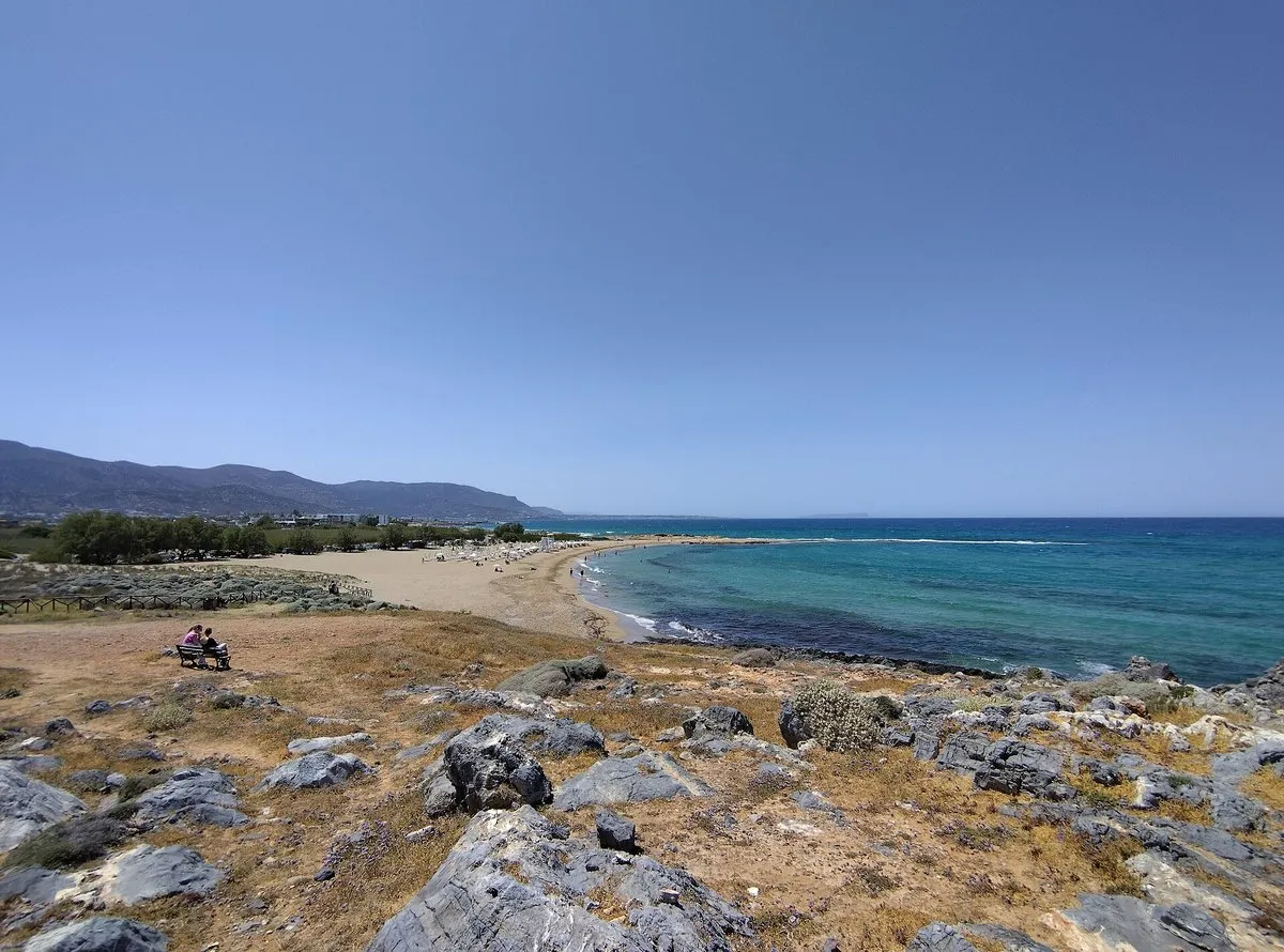 Rocks and open sand at the west end of Potamos