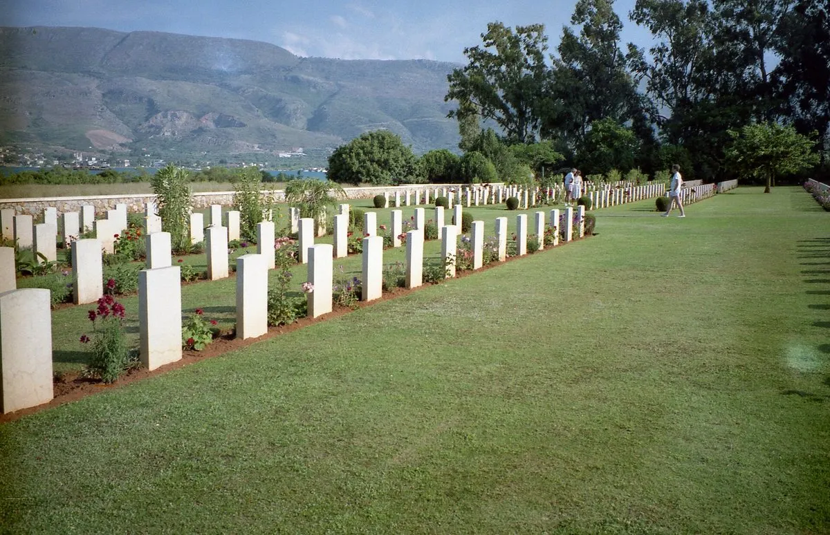 A row of graves at Souda Bay with flowering shrubs between them