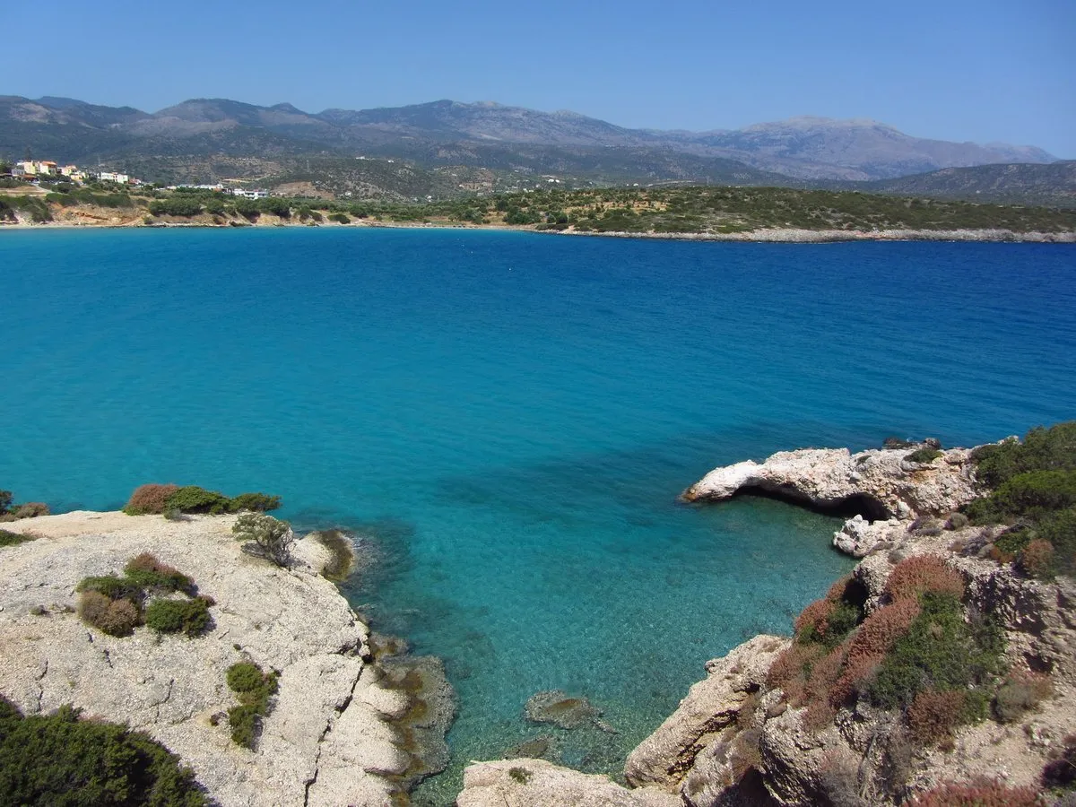 The turquoise shallows of Voulisma from the rocks at the edge of the bay